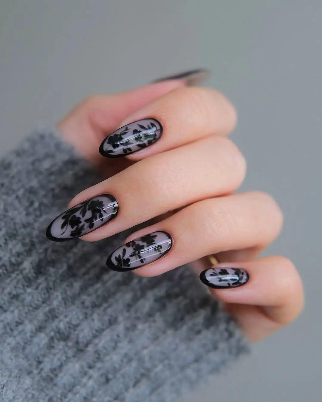 Elegant black floral winter nail design