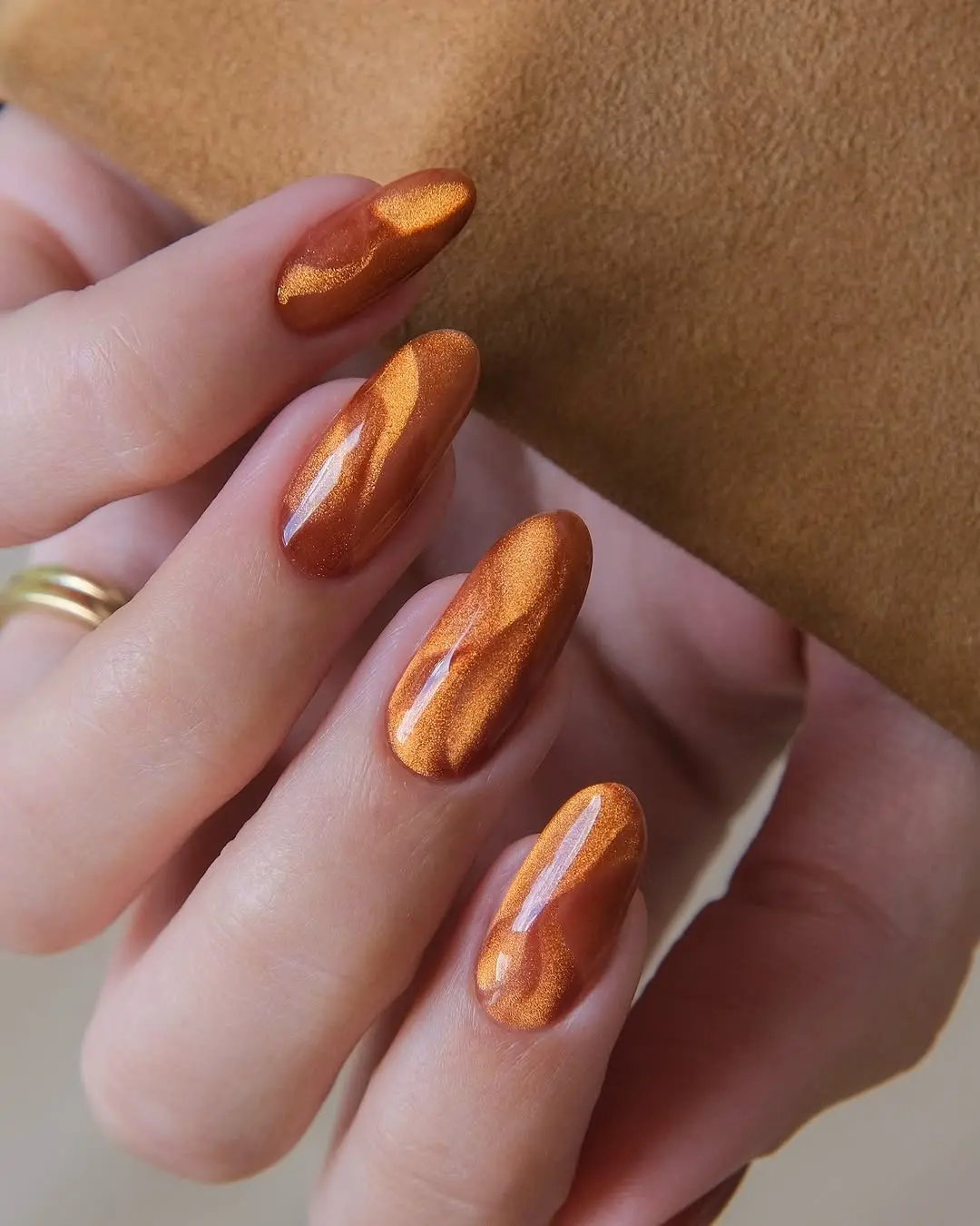 Glamorous Metallic Orange Winter Nail Design