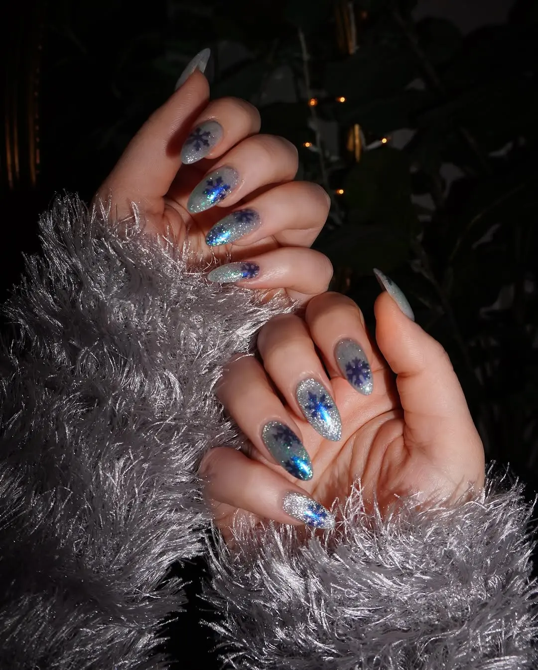 Glimmering winter nails with snowflake accents