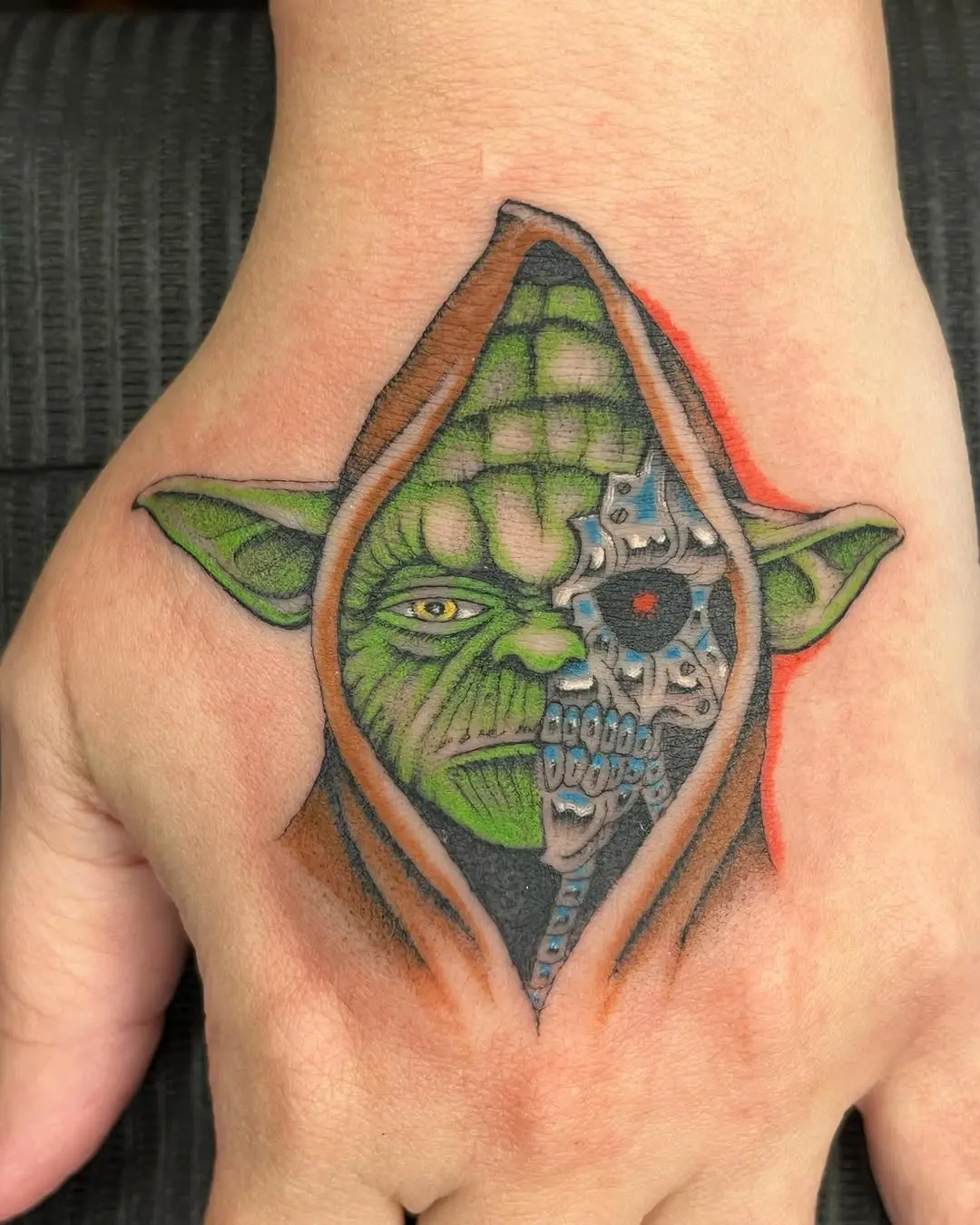 Unique Yoda tattoo with a cybernetic twist