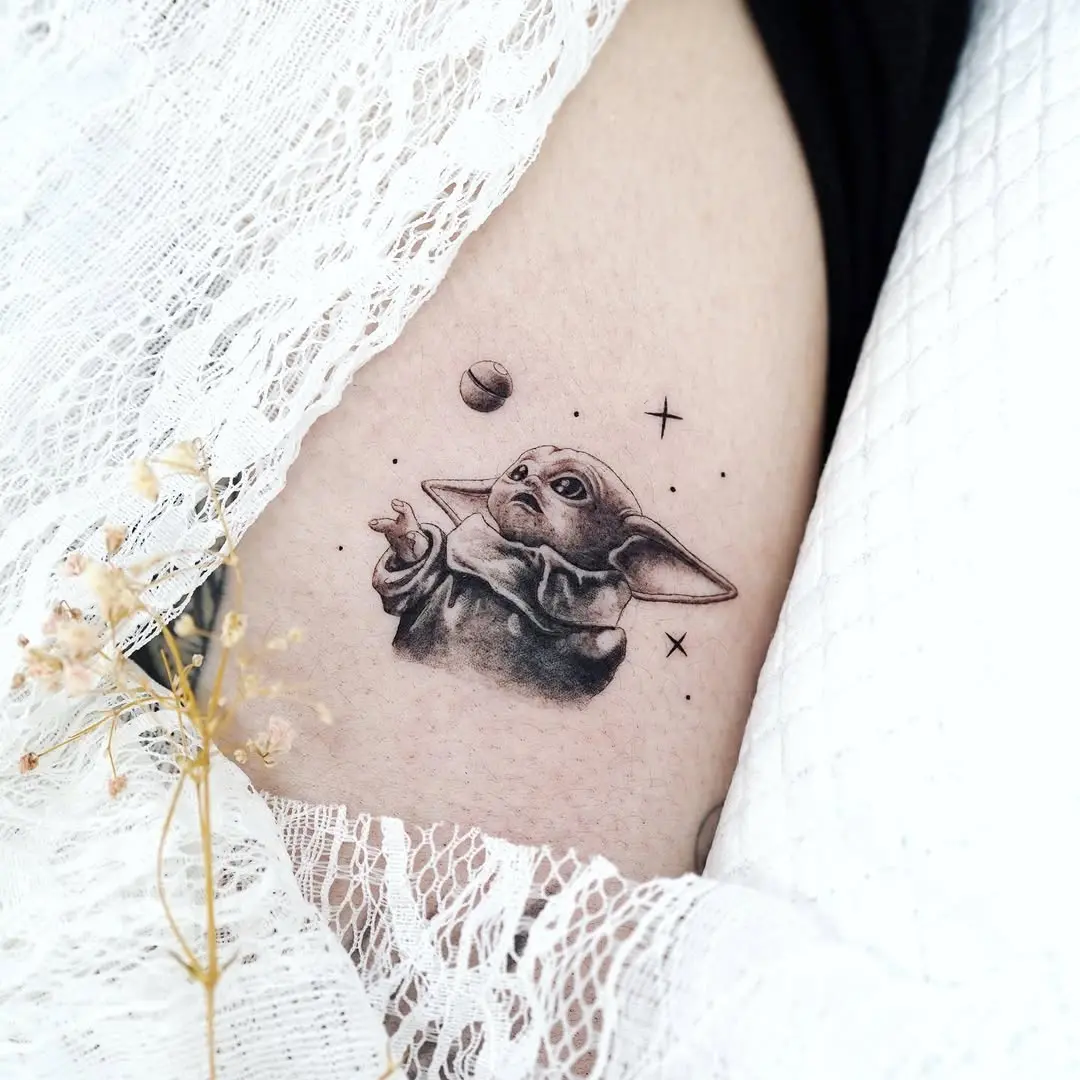 Charming Yoda Tattoo with Cosmic Elements