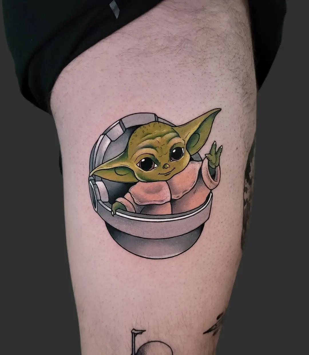 Adorable Yoda tattoo reveals whimsical vibes.