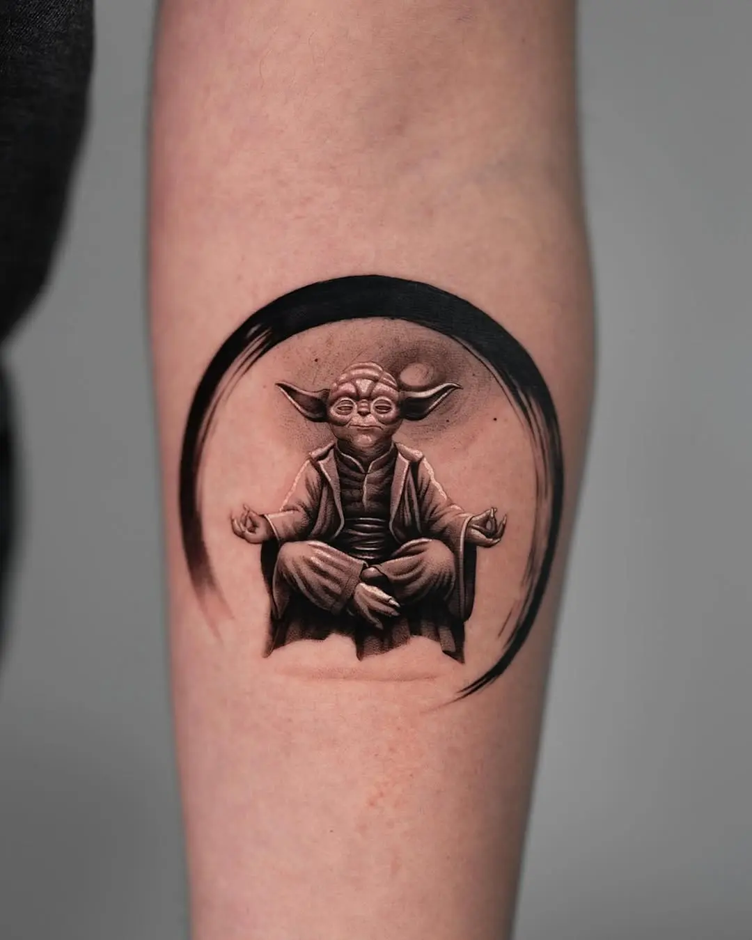Peaceful Yoda in meditative pose tattoo