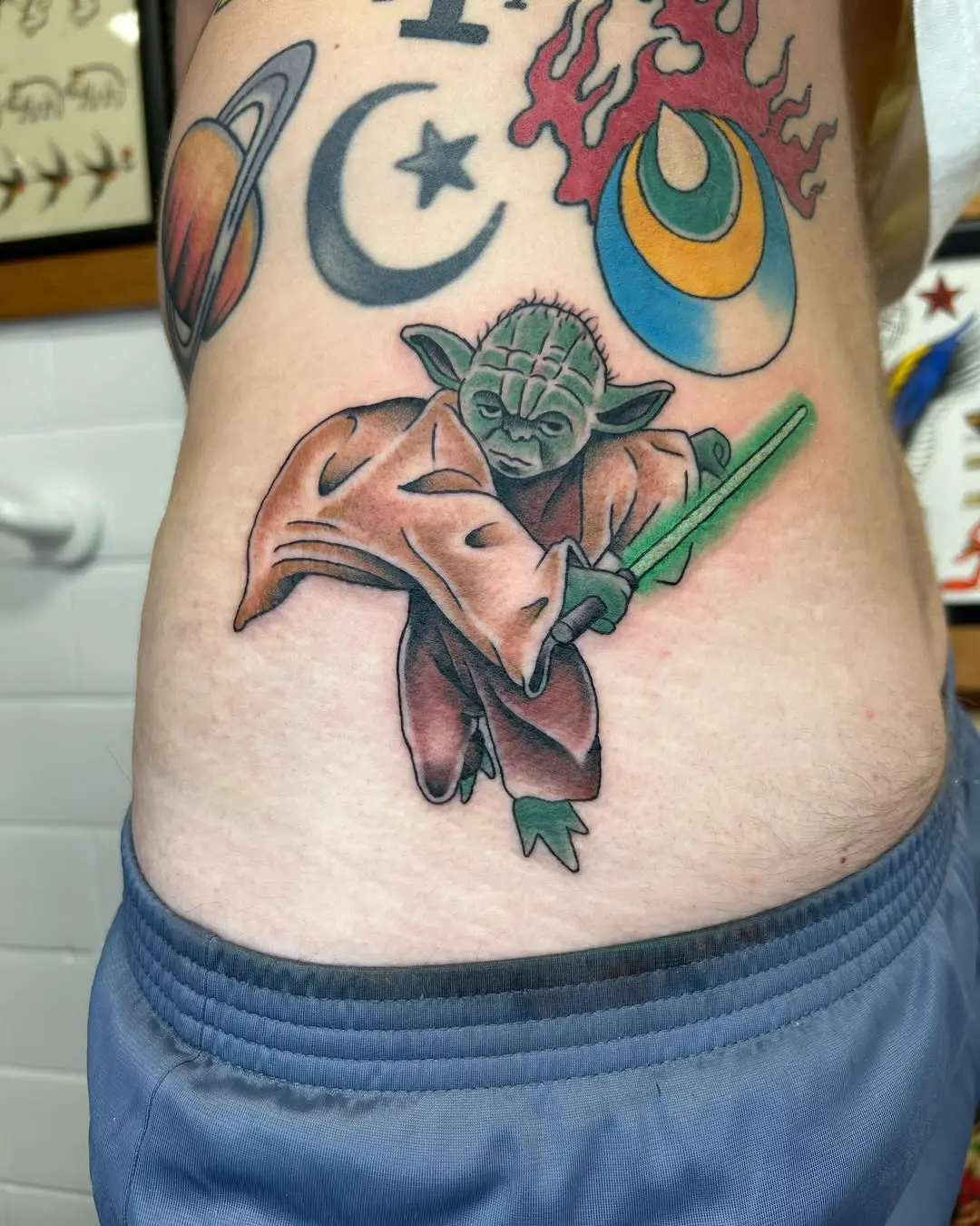 Dynamic Yoda Tattoo with Lightsaber Action