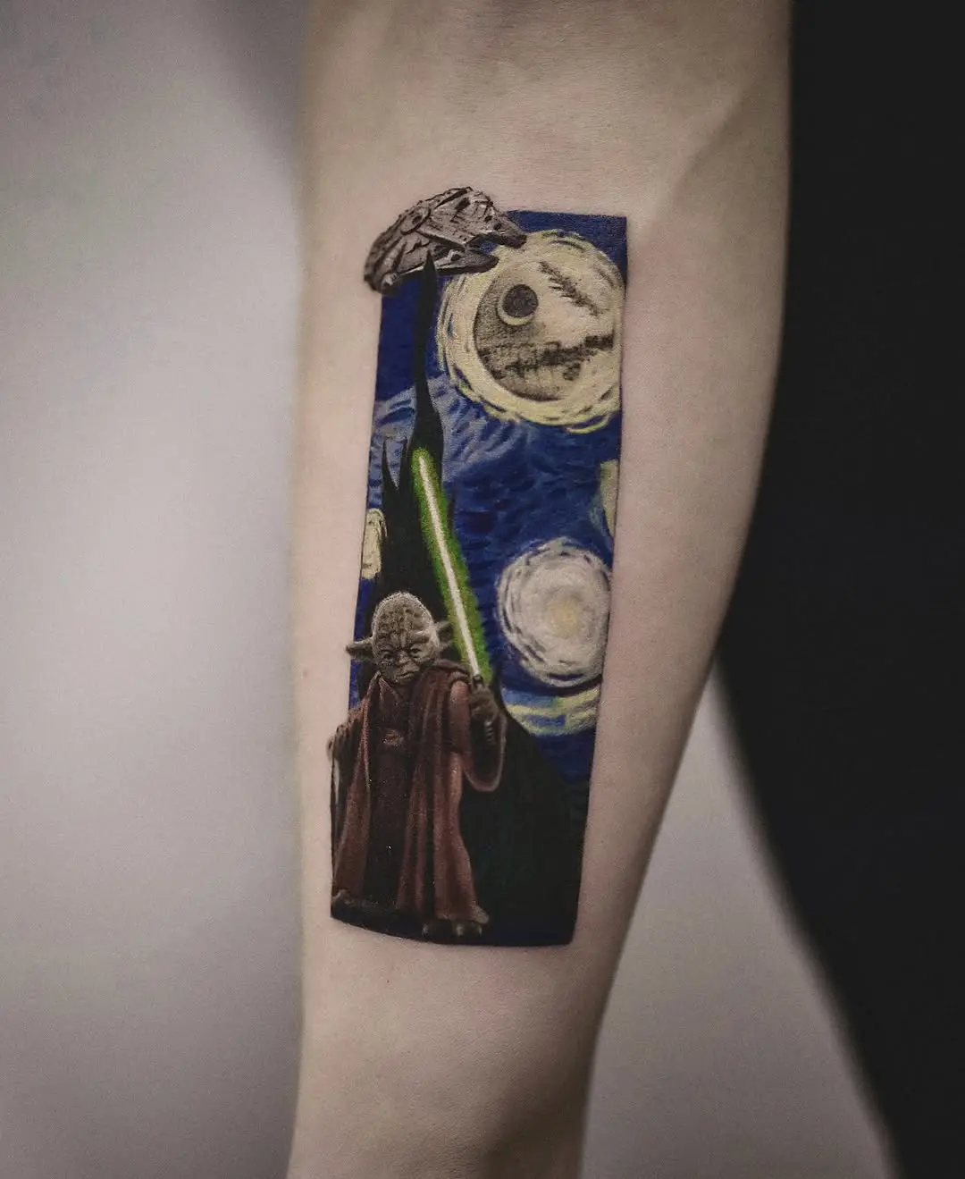 Striking Yoda tattoo with cosmic background