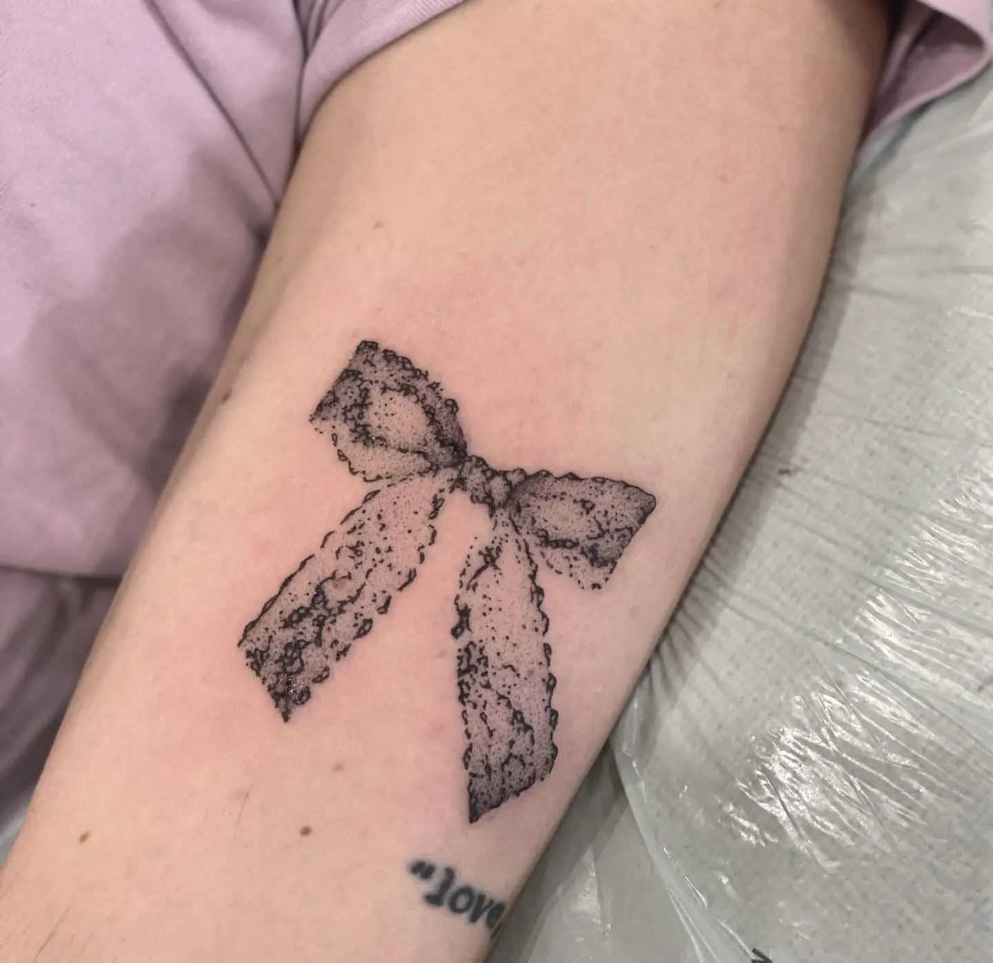 Delicate Lace Bow Tattoo Design on Skin