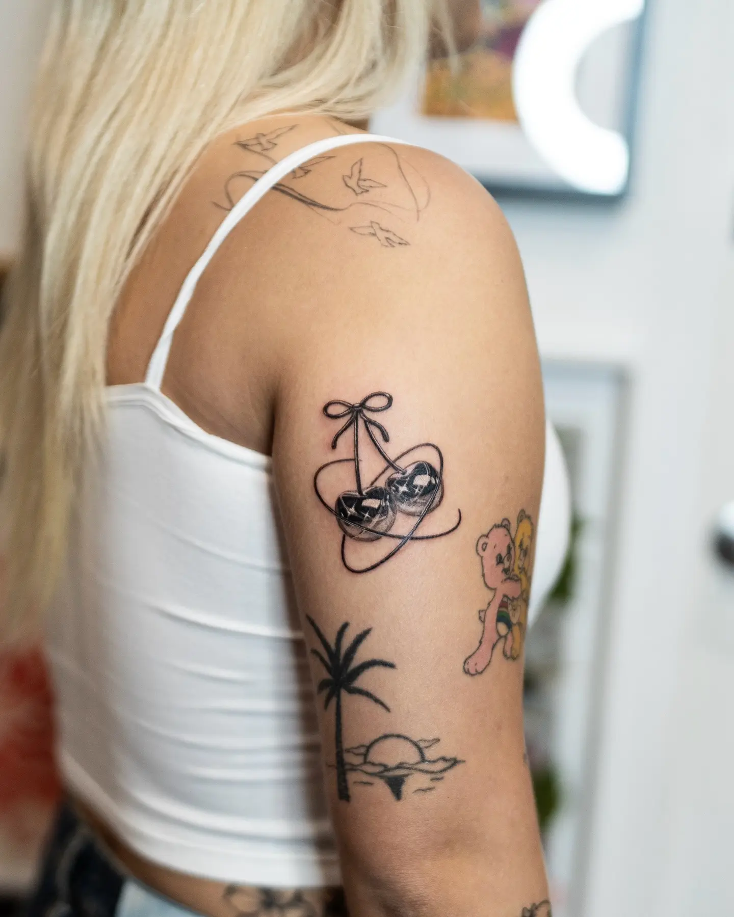 Minimalistic bow tattoo on arm