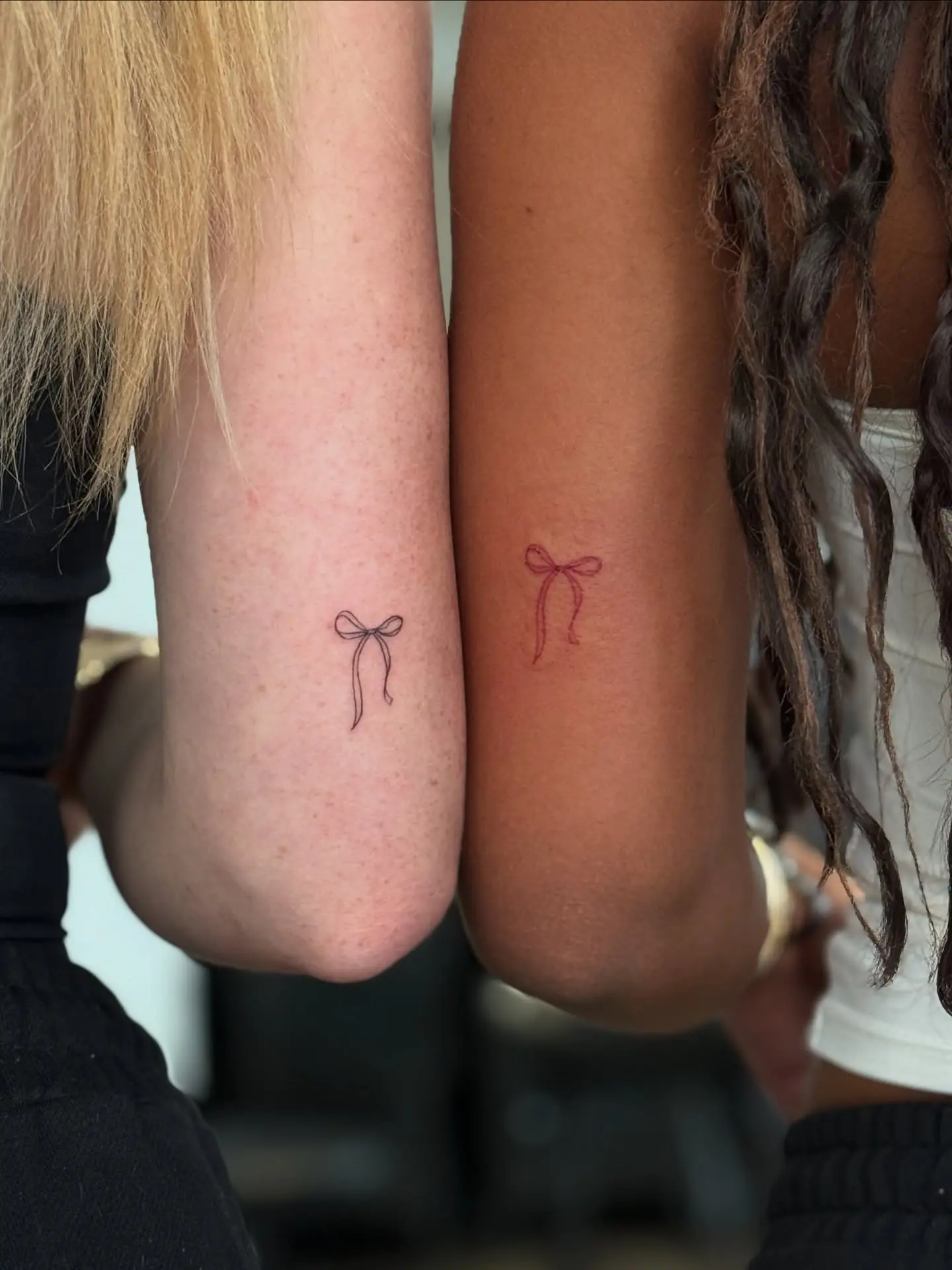 Charming Minimalist Bow Tattoos on Arms