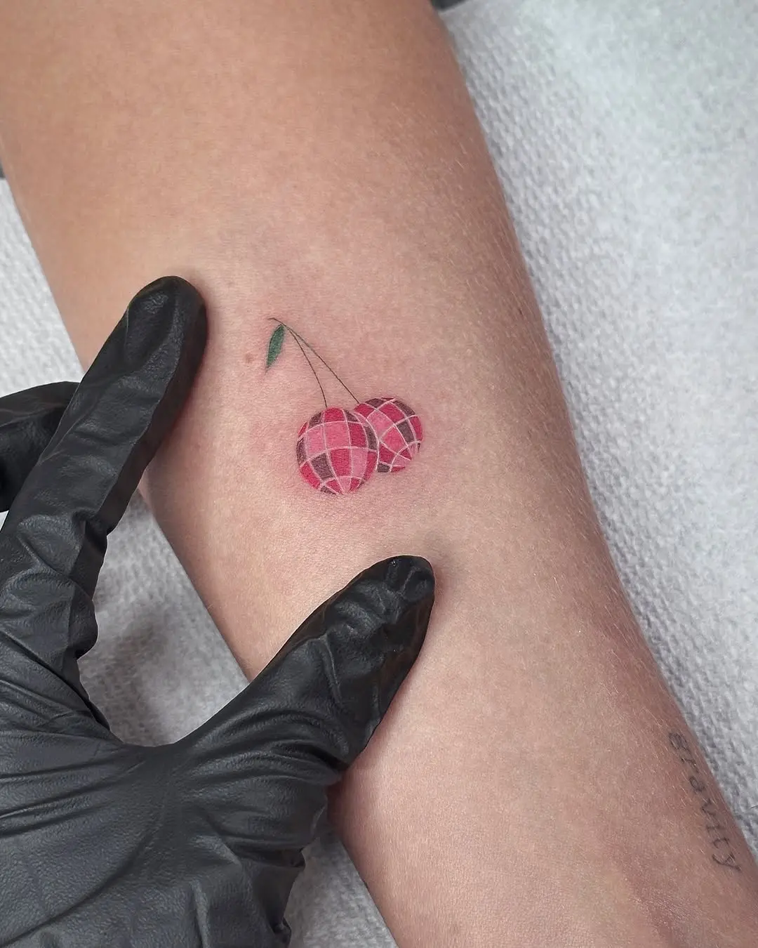 Charming disco ball cherry tattoo design