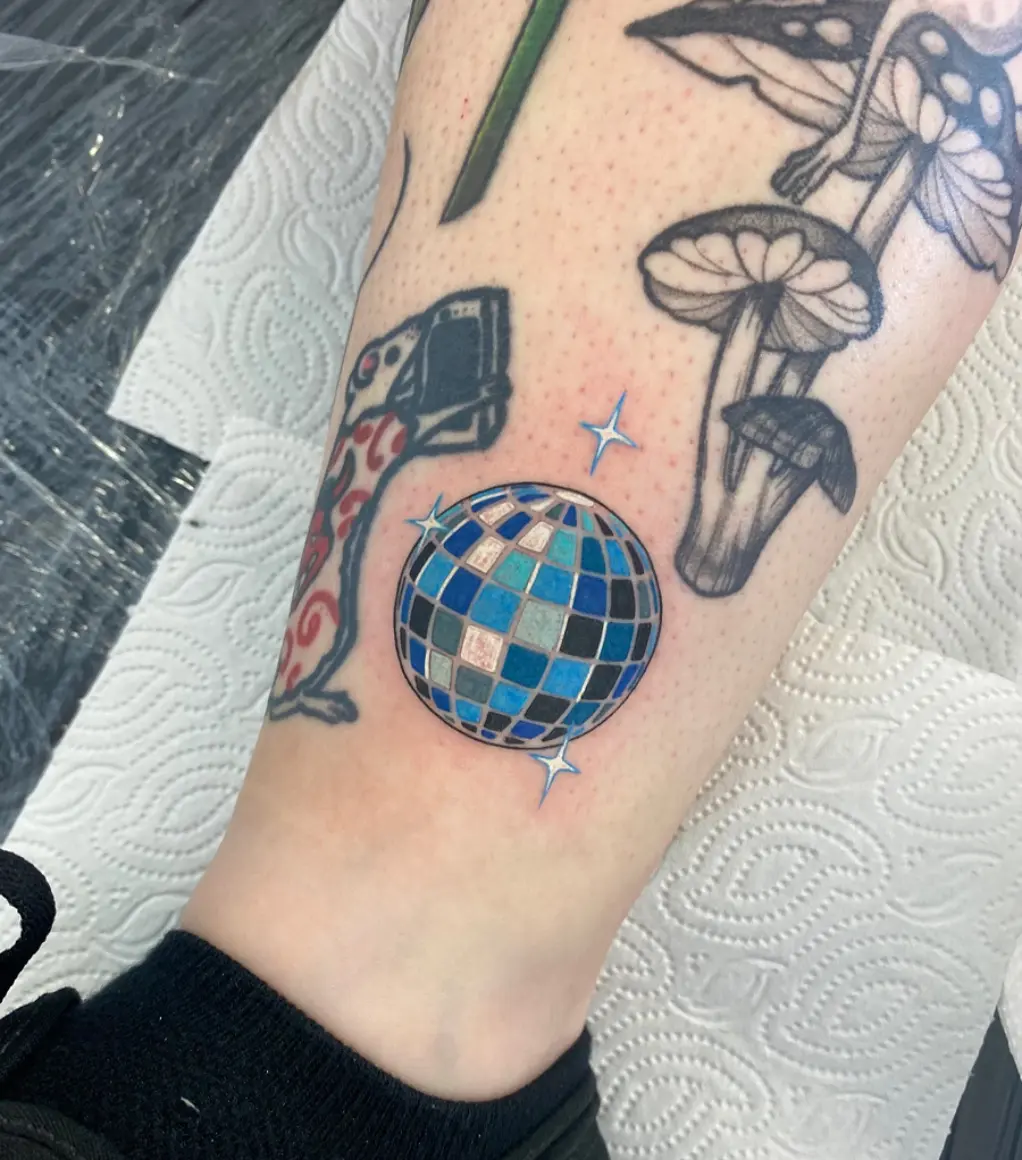 Chic disco ball tattoo with vibrant colors