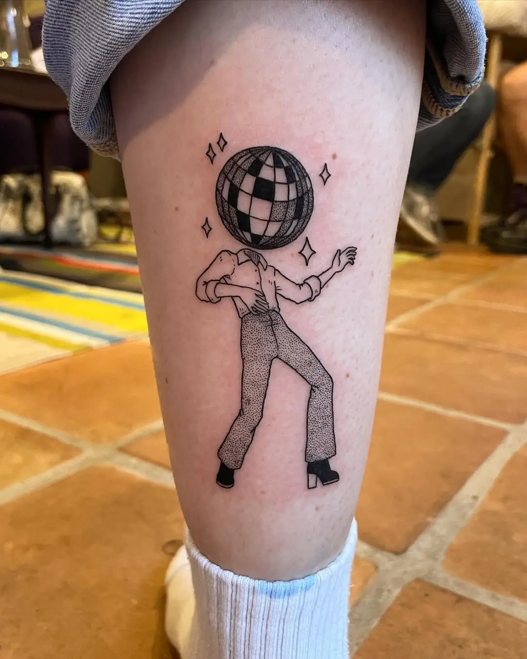 Unique disco ball tattoo with dancing figure