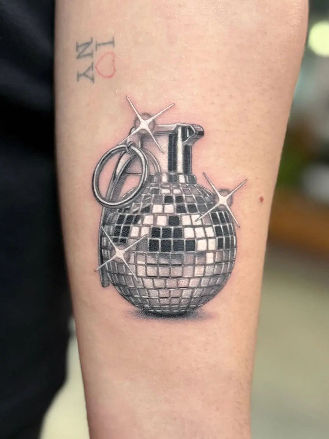 Funky tattoo blending disco and danger