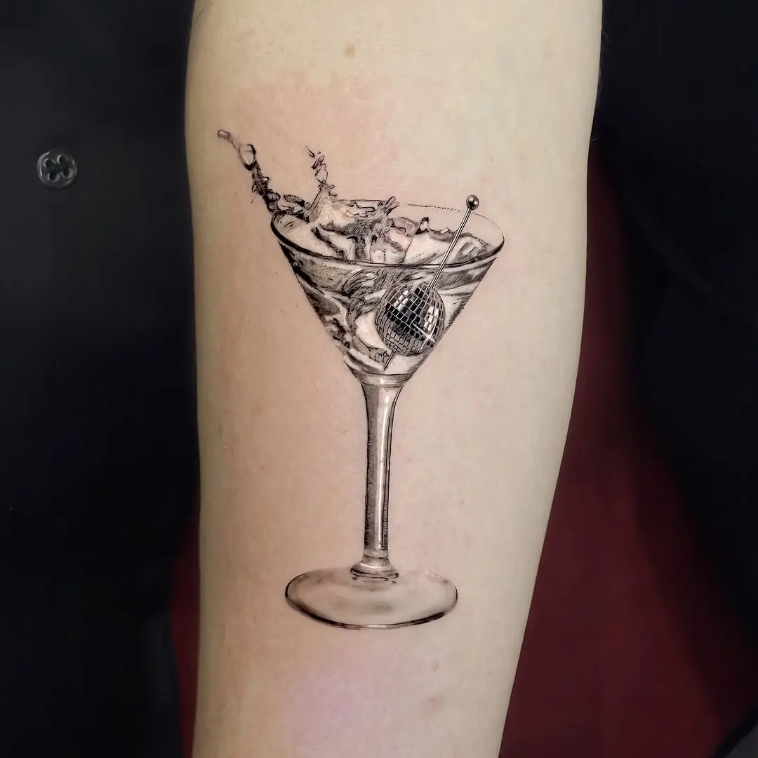 Stylish disco ball martini tattoo design