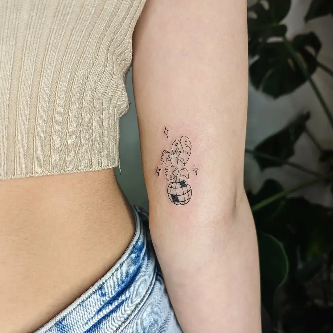 Chic Disco Ball Tattoo with Tropical Vibes