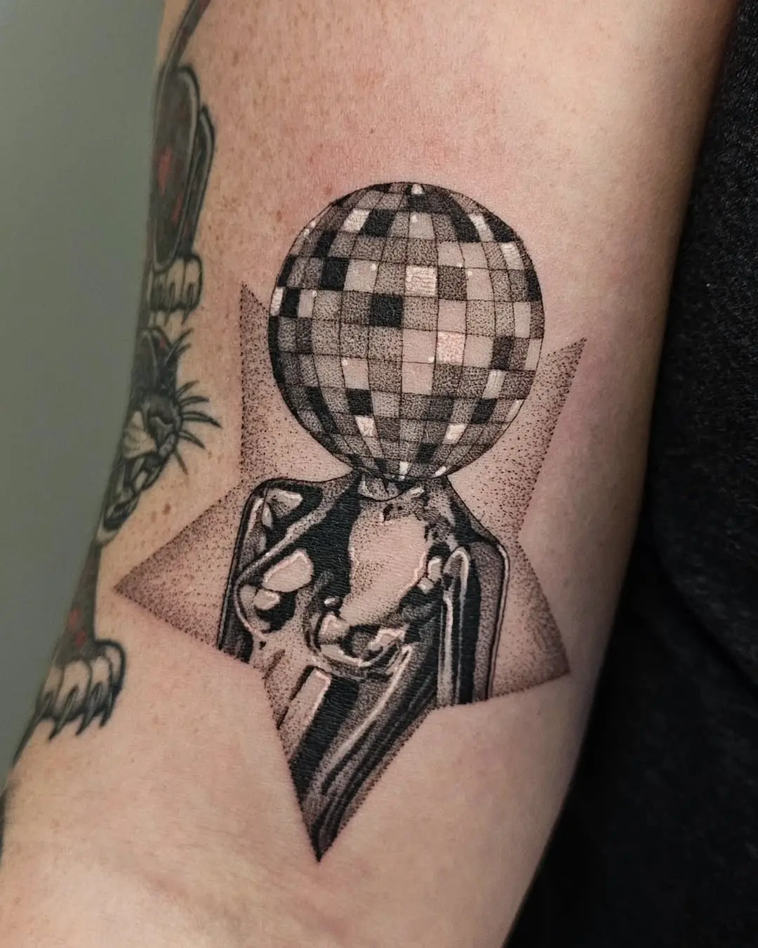 Unique disco ball tattoo with stylish star background