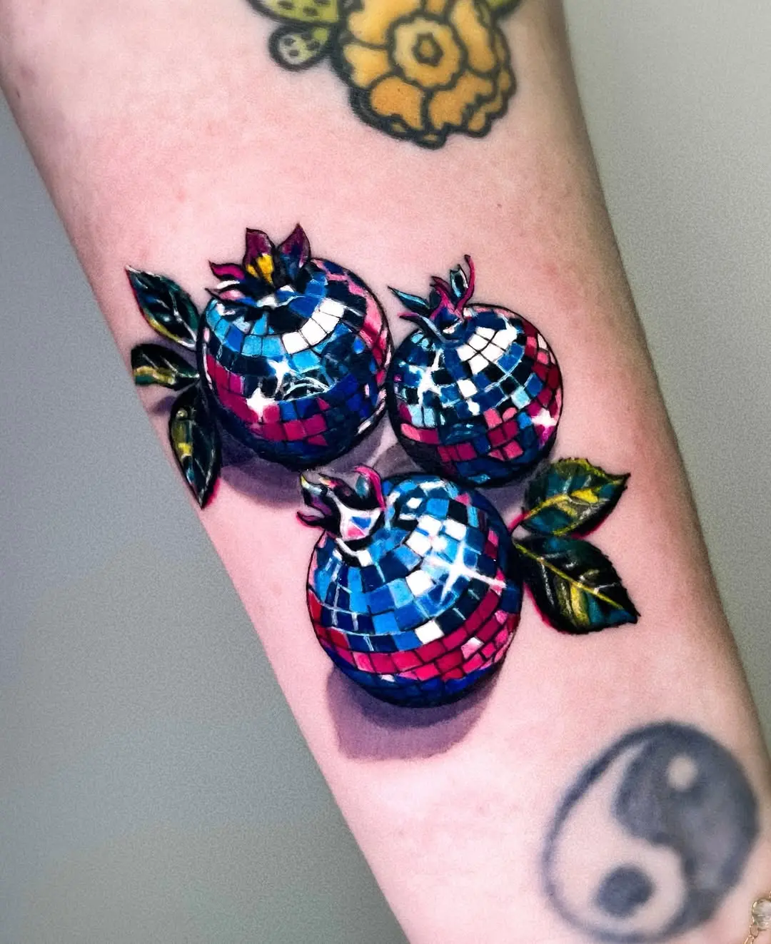Vivid Disco Ball Tattoos with Floral Elements