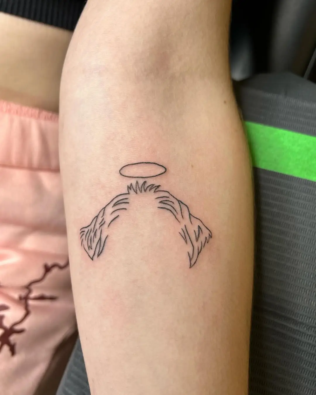 Simple yet meaningful dog ear tattoo design