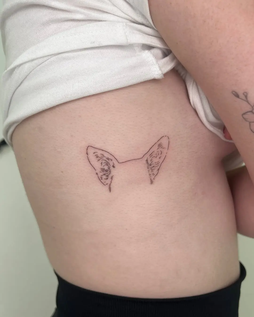 Minimalist Dog Ear Tattoo on Skin