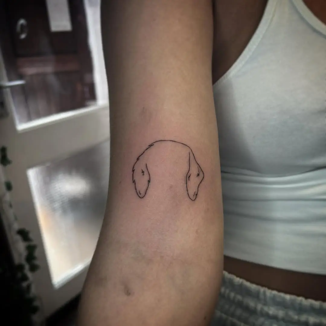 Charming and simple dog ear tattoo design
