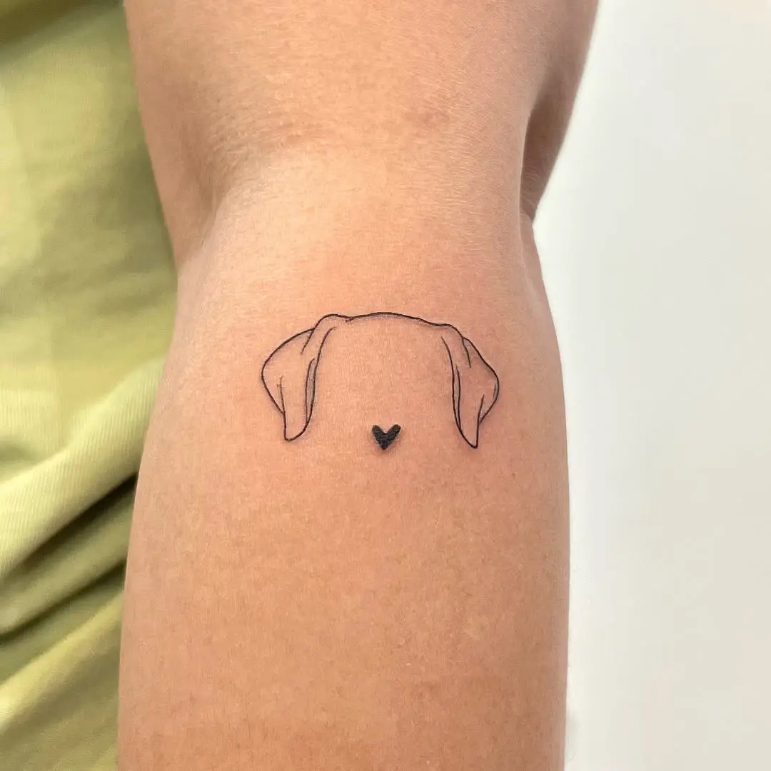 Minimalist dog ear tattoo design revealed