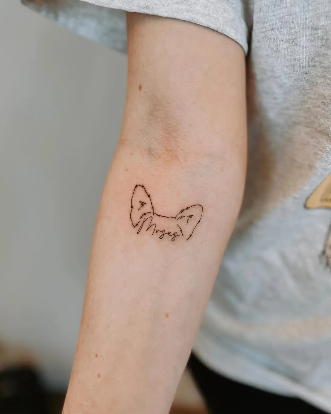 Charming Dog Ear Tattoo with Personal Touch
