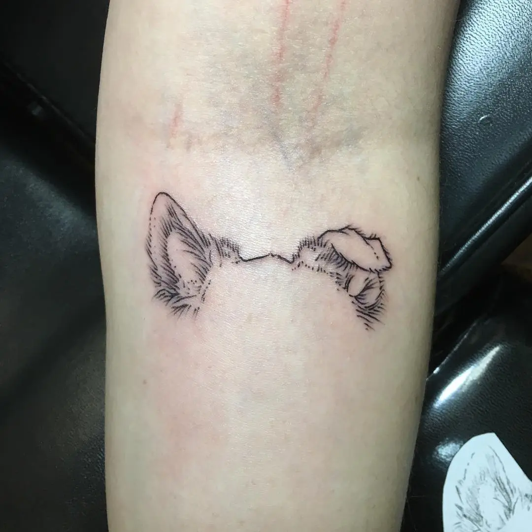 Charming silhouette of dog ears tattoo