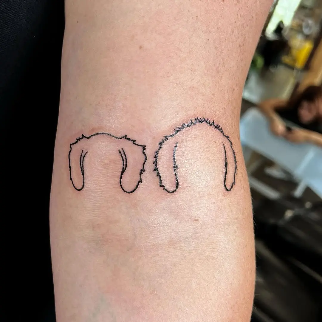 Minimalist dog ear tattoo design