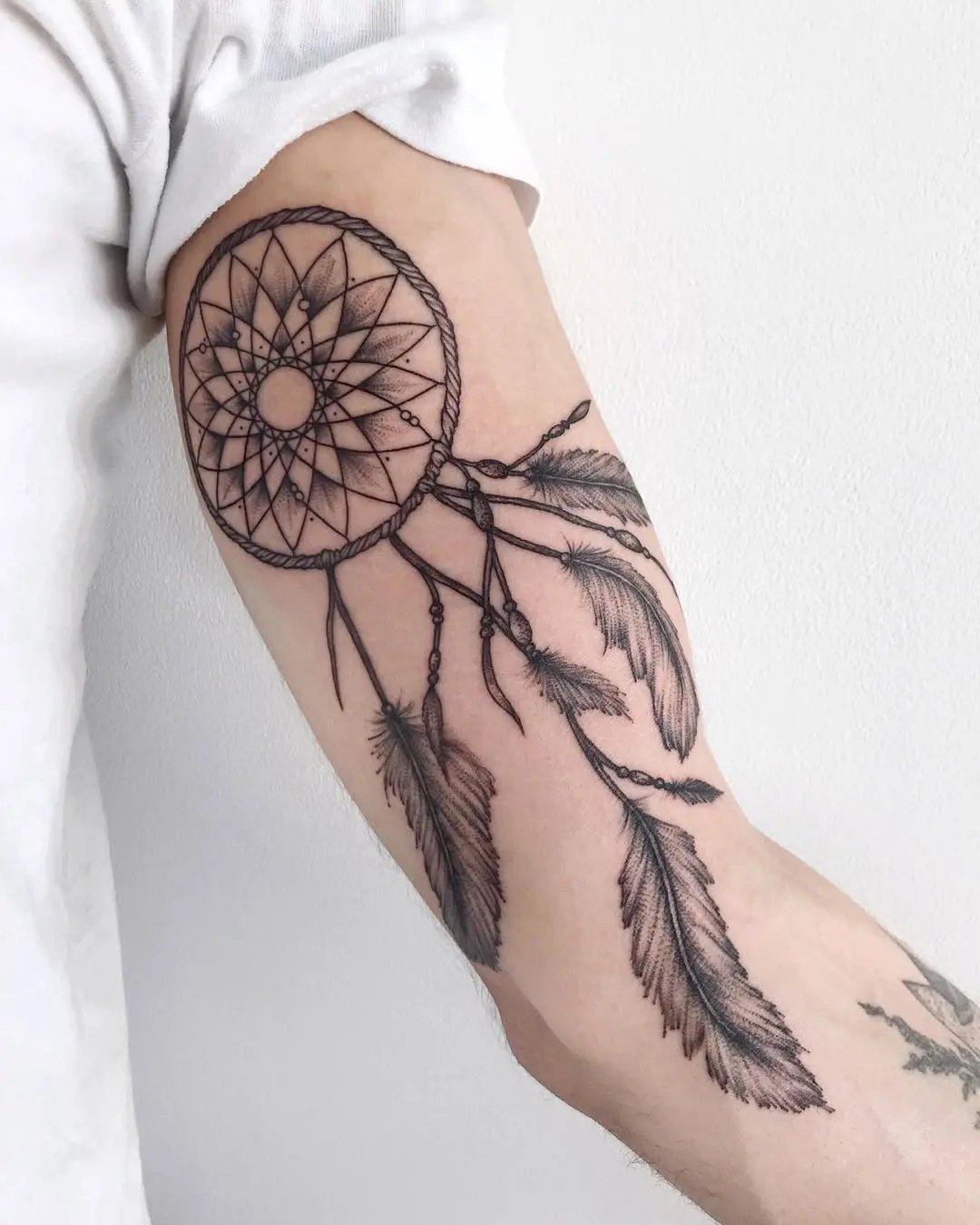 Elegant black ink dreamcatcher tattoo design