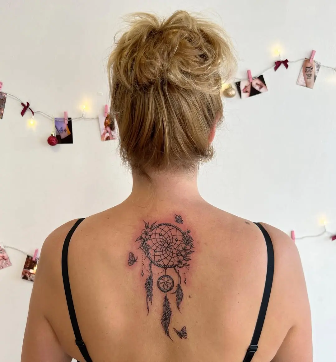 Elegant dreamcatcher tattoo with butterflies and feathers