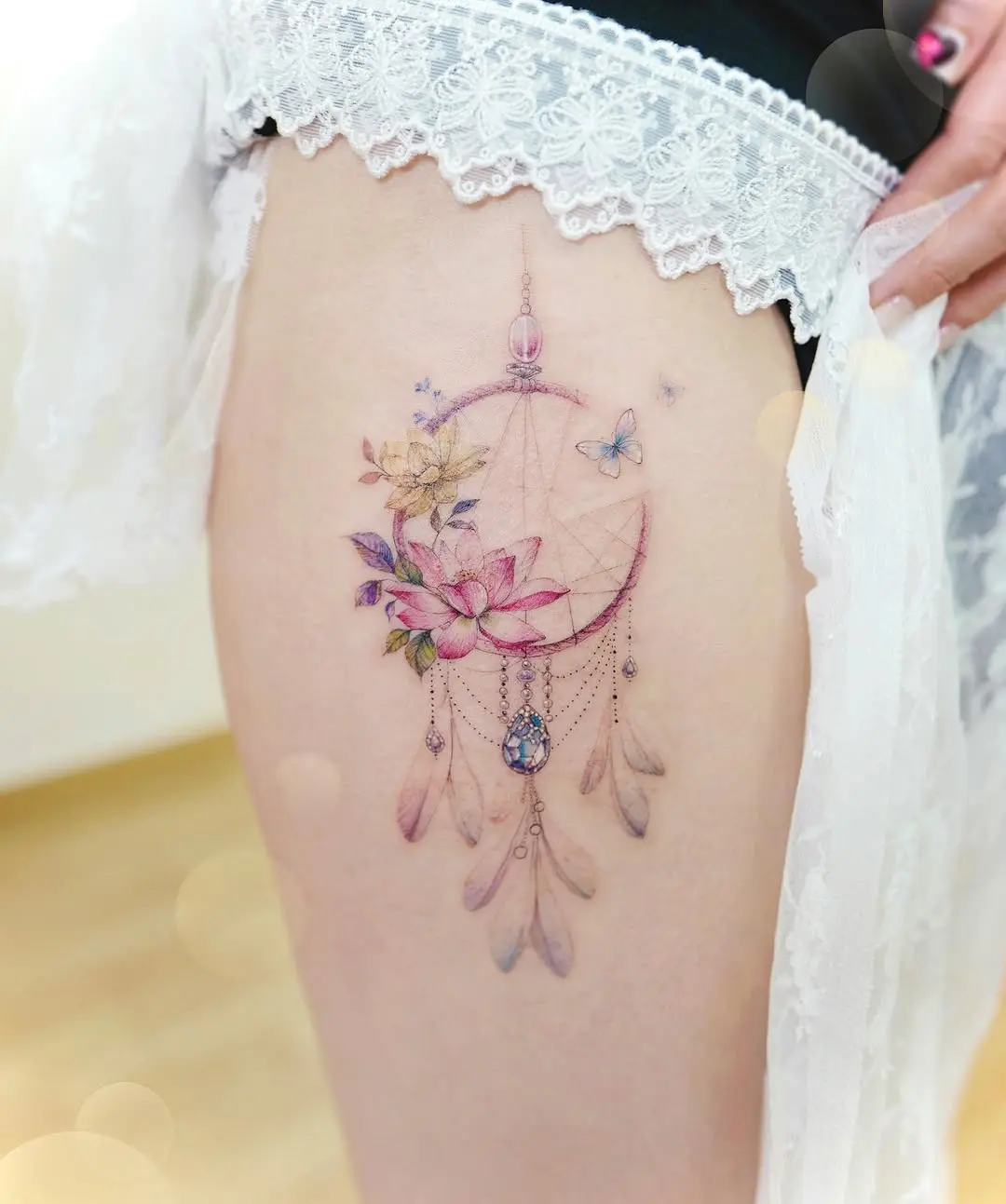 Vibrant Dreamcatcher Tattoo with Floral Elements
