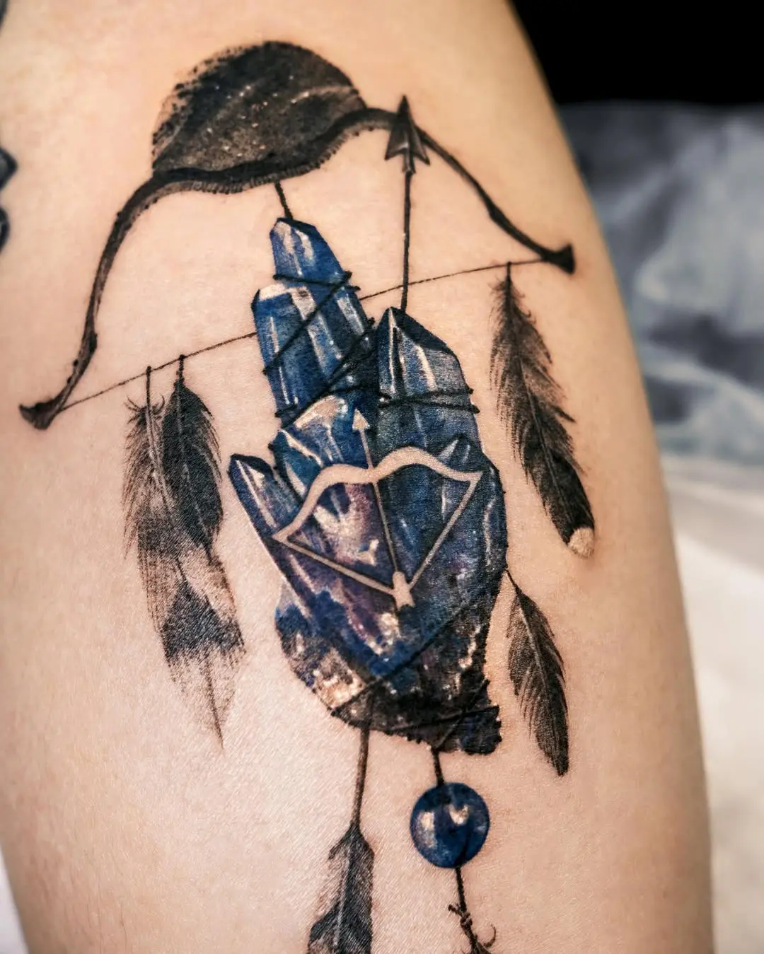 Mystical hand with dreamcatcher elements tattoo