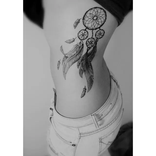 Elegant dreamcatcher tattoo on the rib area