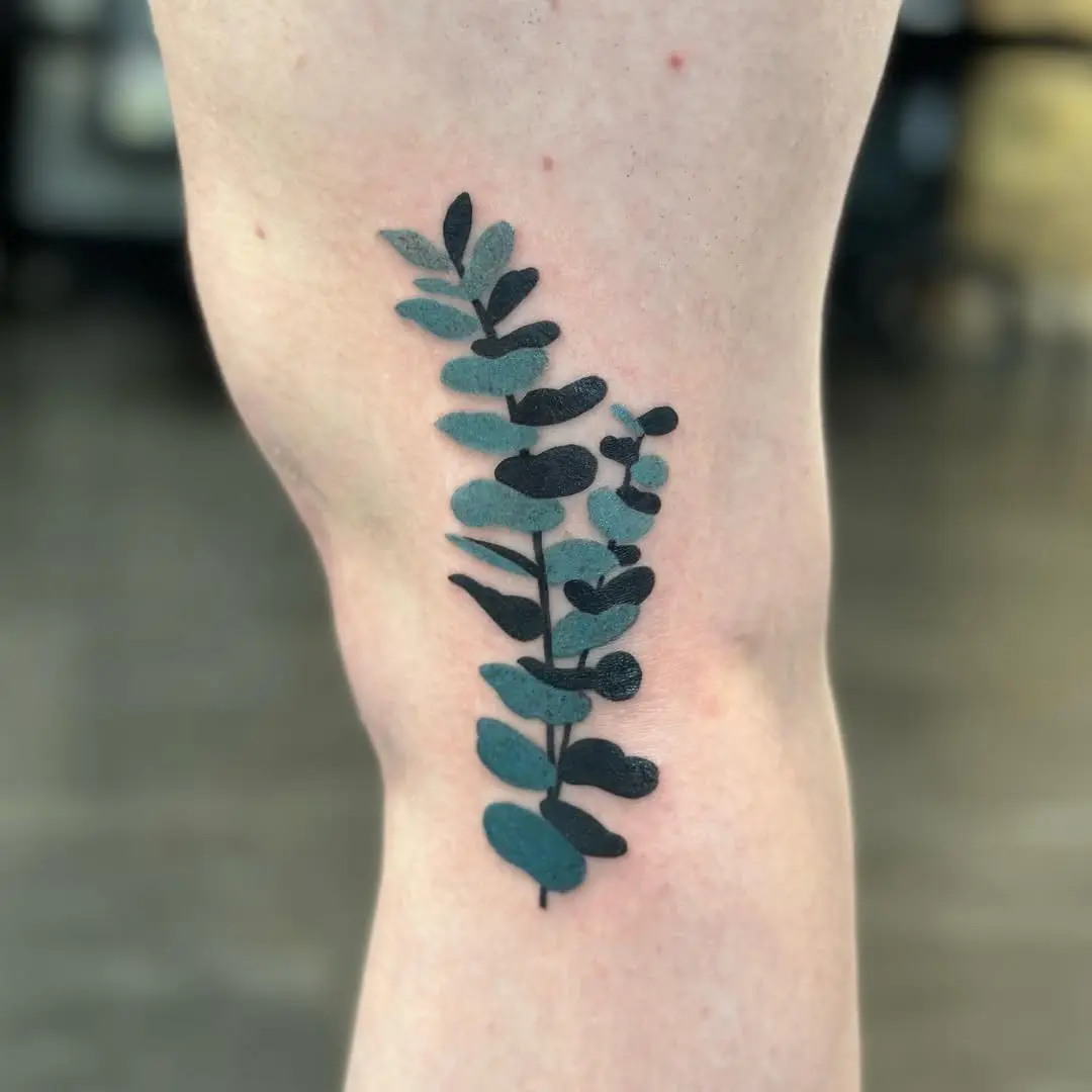 Stylish eucalyptus tattoo with elegant leaf design