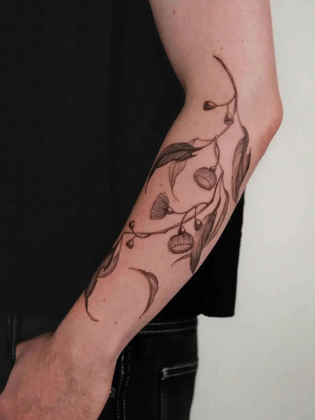 Elegant eucalyptus tattoo showcases nature's beauty