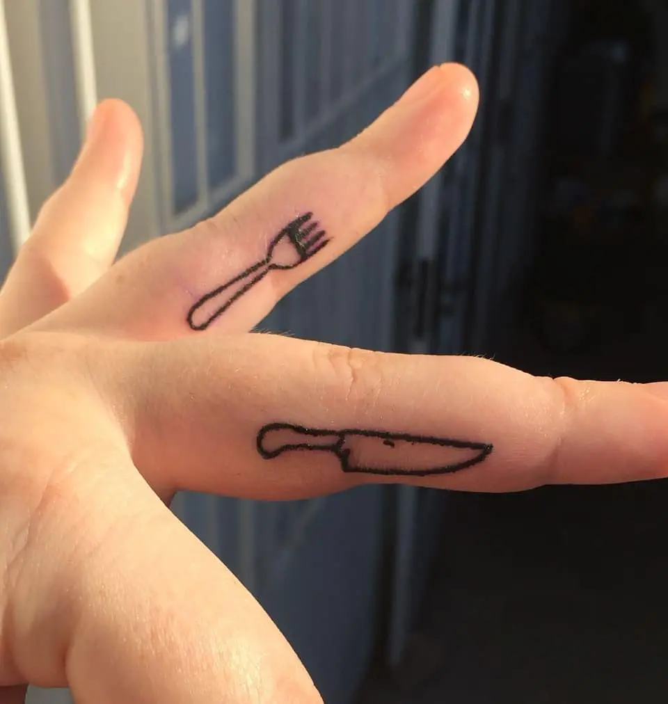 Unique fork and knife tattoos on fingers