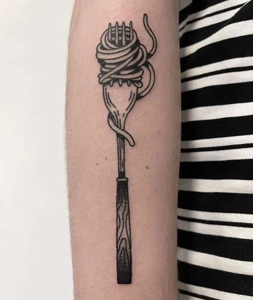 Whimsical fork tattoo with tangled spaghetti.