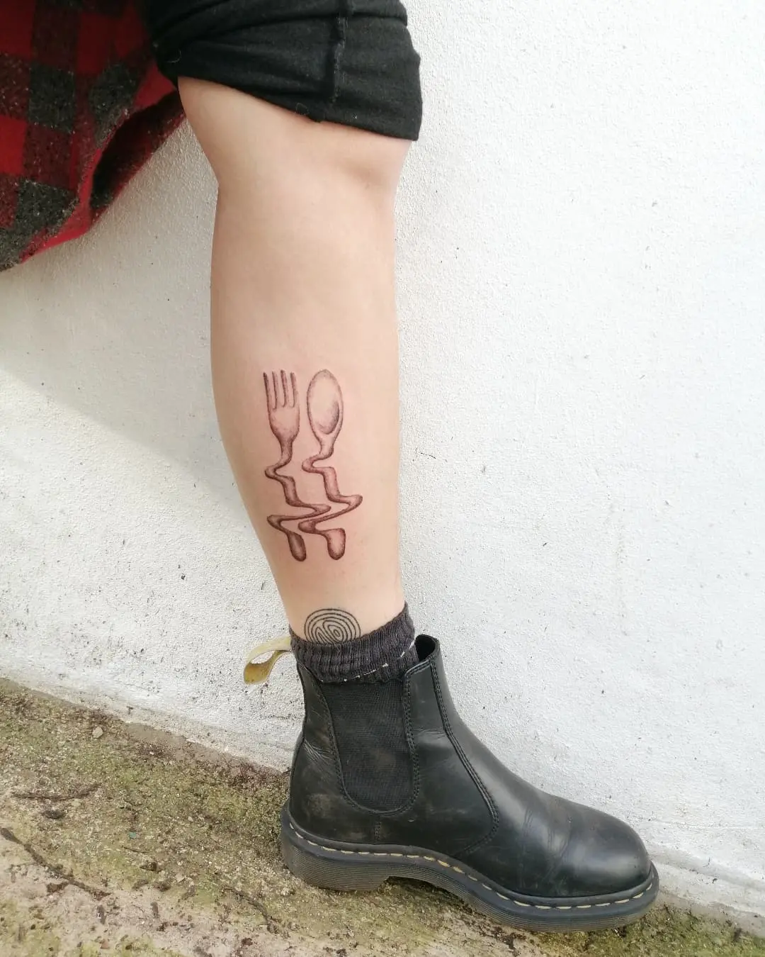Unique fork and spoon tattoo design on leg