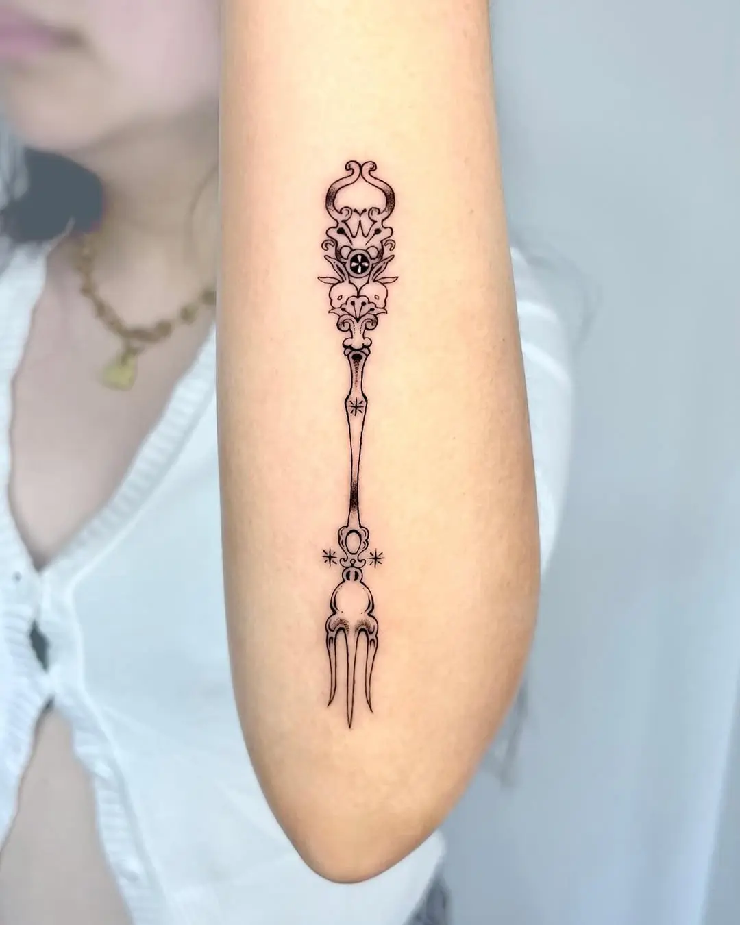 Sleek Fork Tattoo with Intricate Detailing
