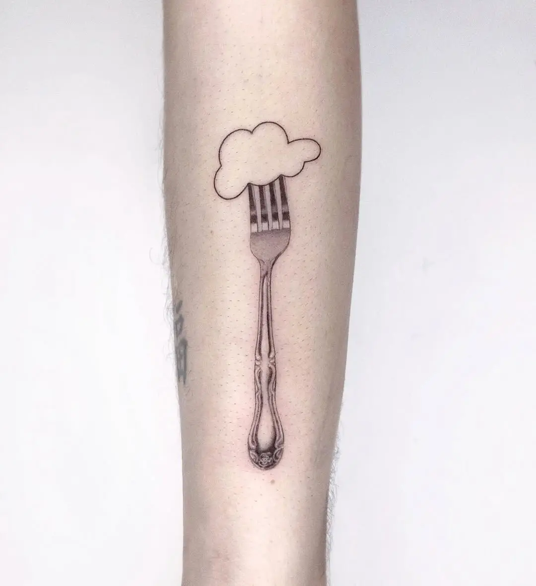 Creative fork tattoo with a whimsical twist