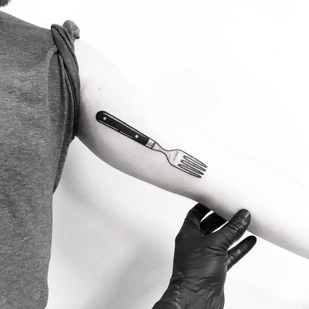 Artistic fork tattoo with a realistic touch