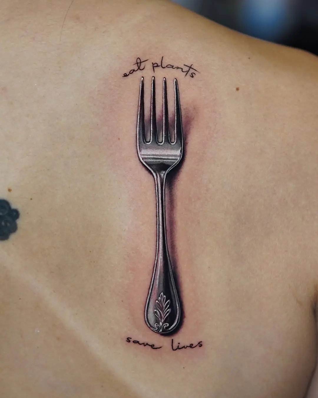 Stylish fork tattoo with plant-based message