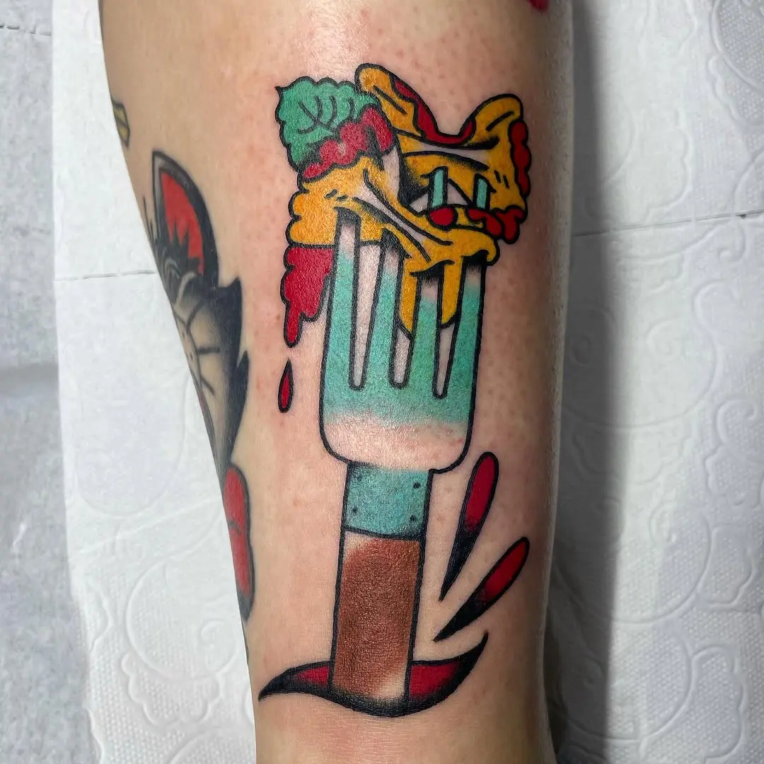 Vibrant fork tattoo with playful food theme