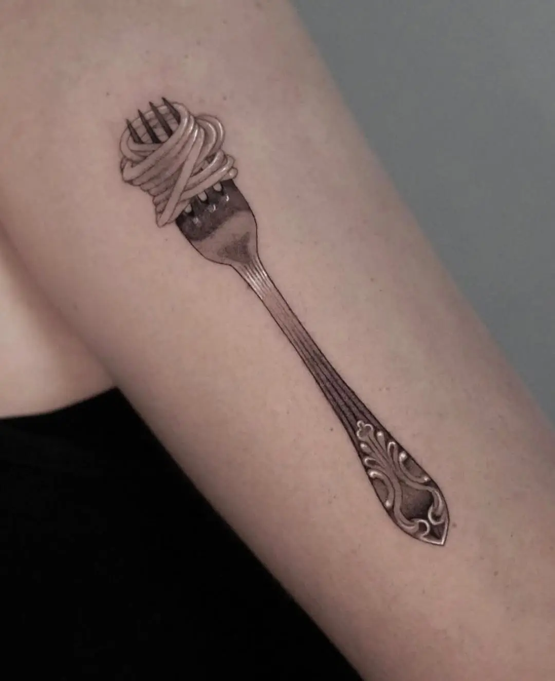 Unique fork and spaghetti tattoo design