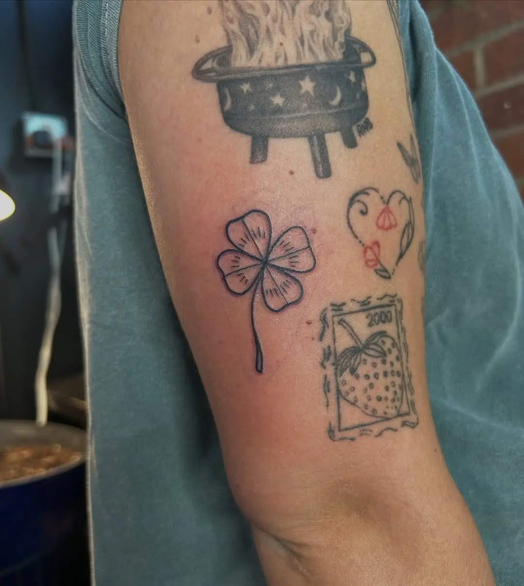 Minimalist four leaf clover tattoo design