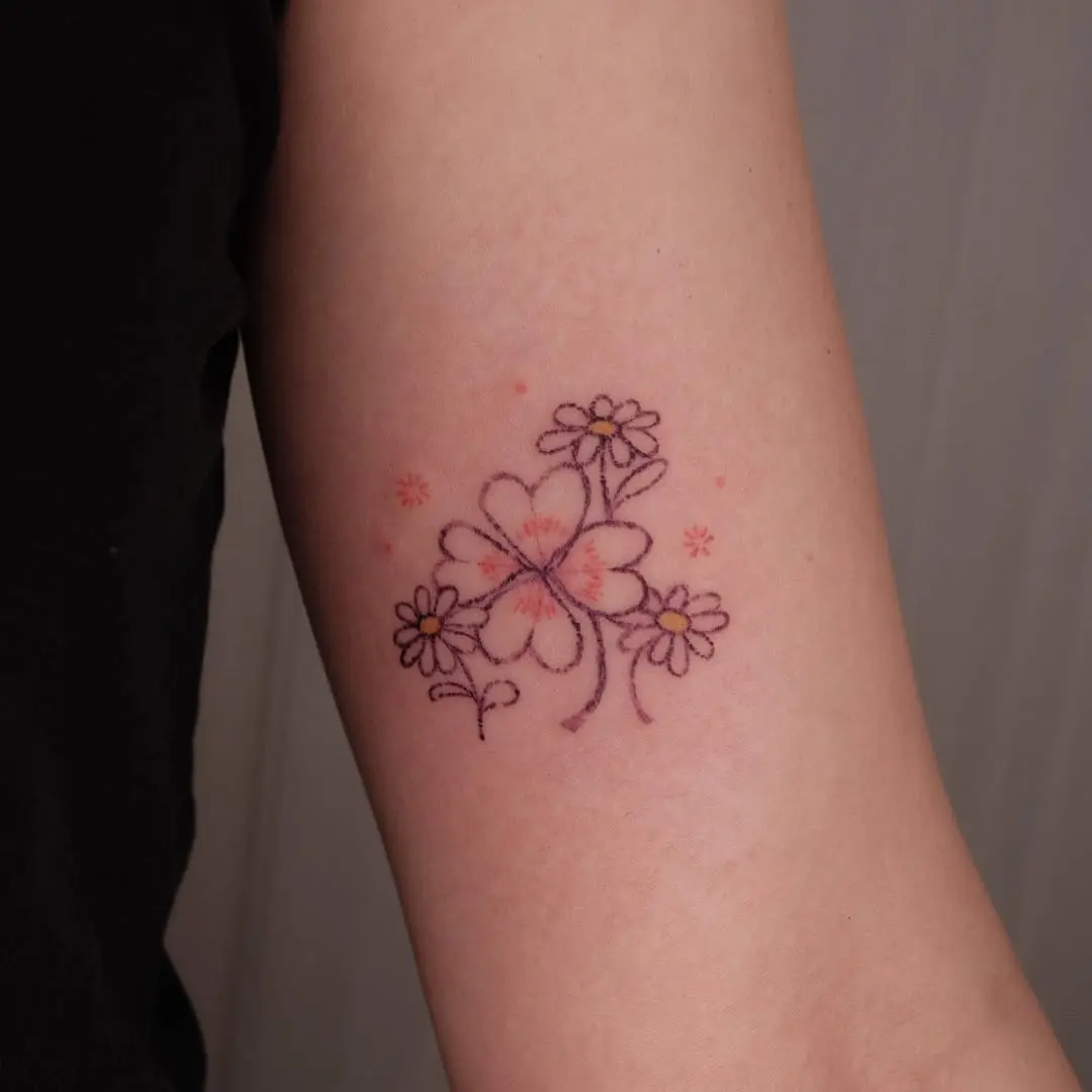 Charming four leaf clover floral tattoo details