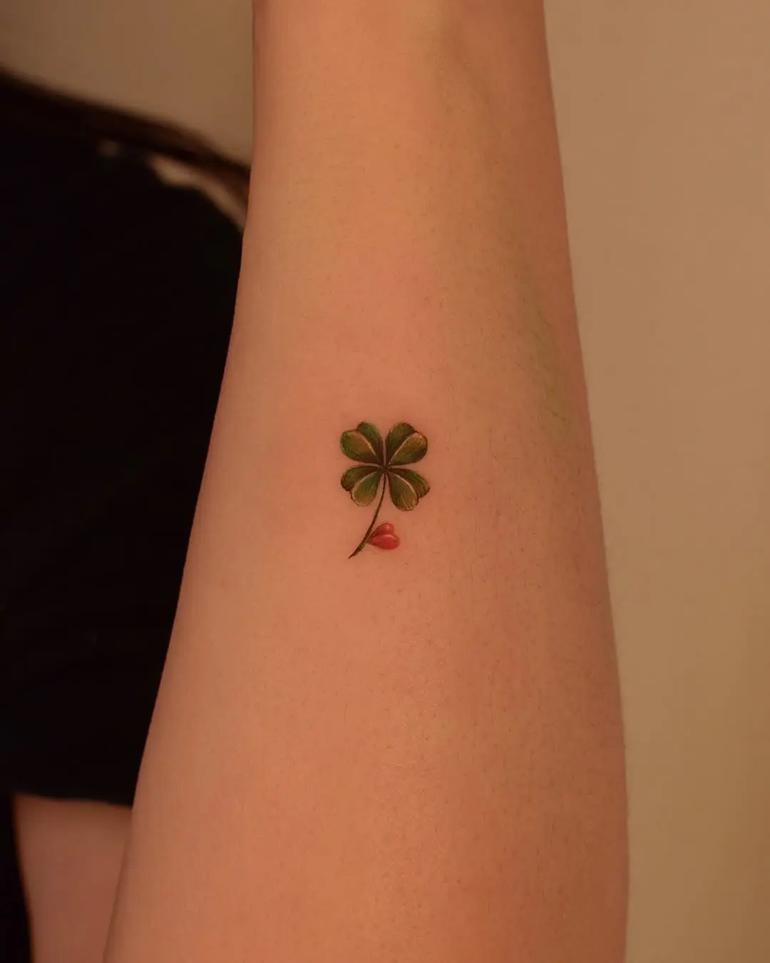 Charming four leaf clover tattoo design on arm