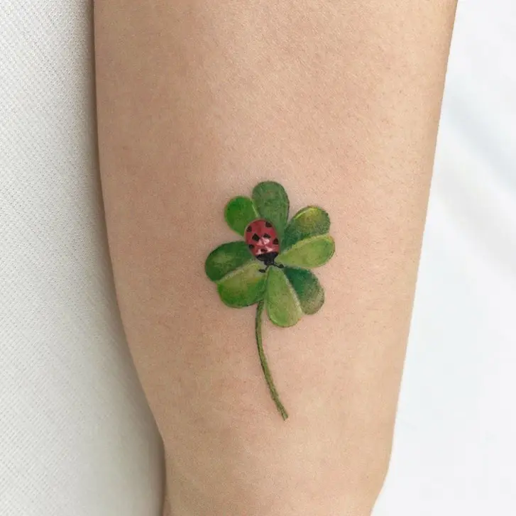 Charming four-leaf clover with ladybug detail