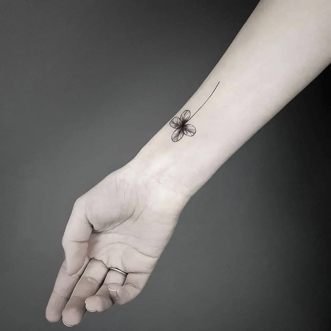 Elegant Minimalist Four Leaf Clover Tattoo