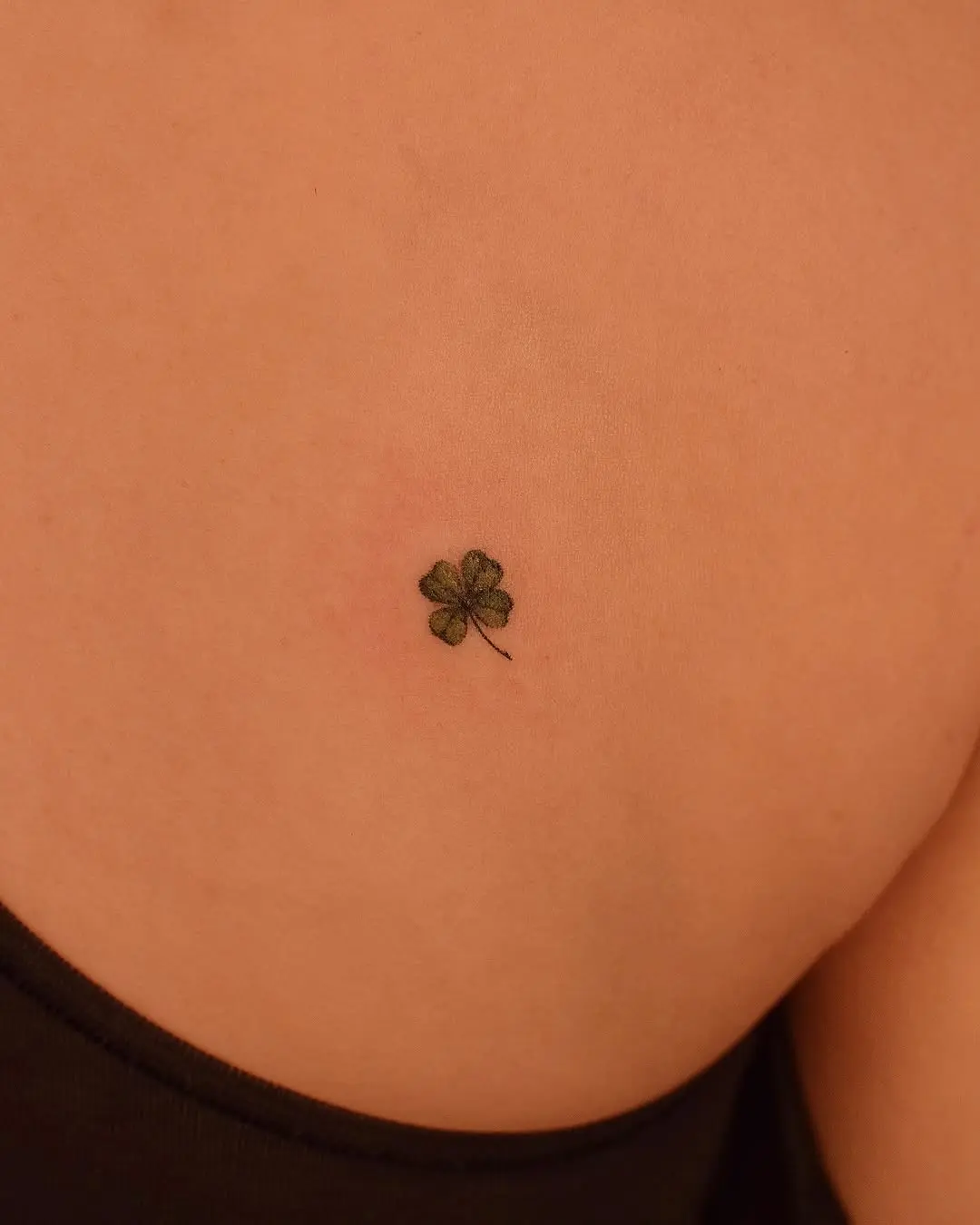 Charming small four leaf clover tattoo design