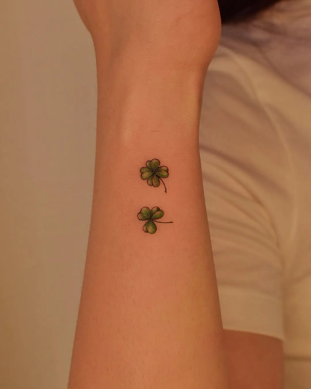 Charming small four leaf clover tattoos